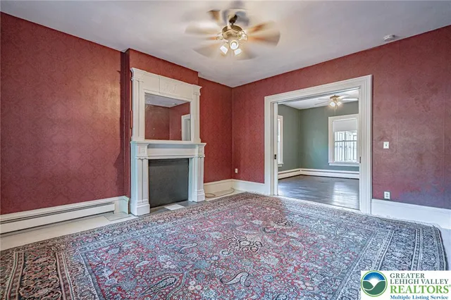 a view of a livingroom with furniture and stairs