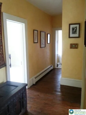 a bathroom with a sink a toilet and tub