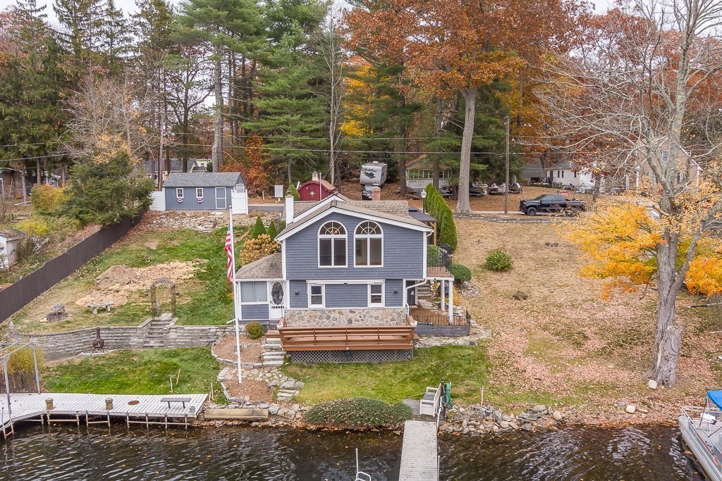 59 Cranberry Meadow Shore Road Charlton, MA 01507 - Photo 1 of 36 a front view of a house with a yard