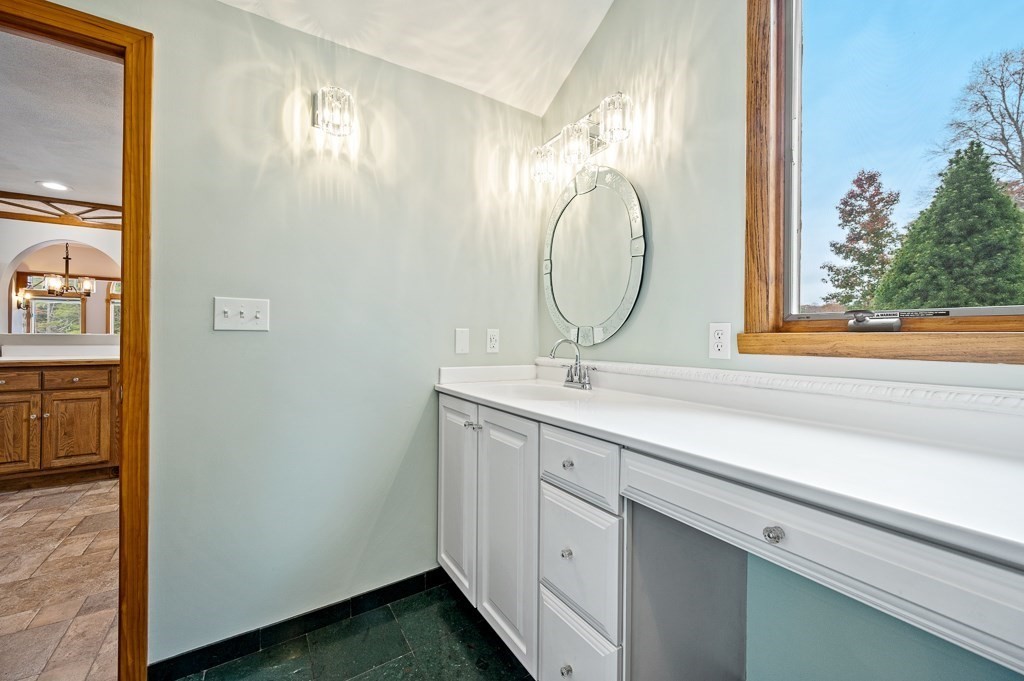 59 Cranberry Meadow Shore Road Charlton, MA 01507 - Photo 14 of 36 a bathroom with a double vanity sink and a mirror