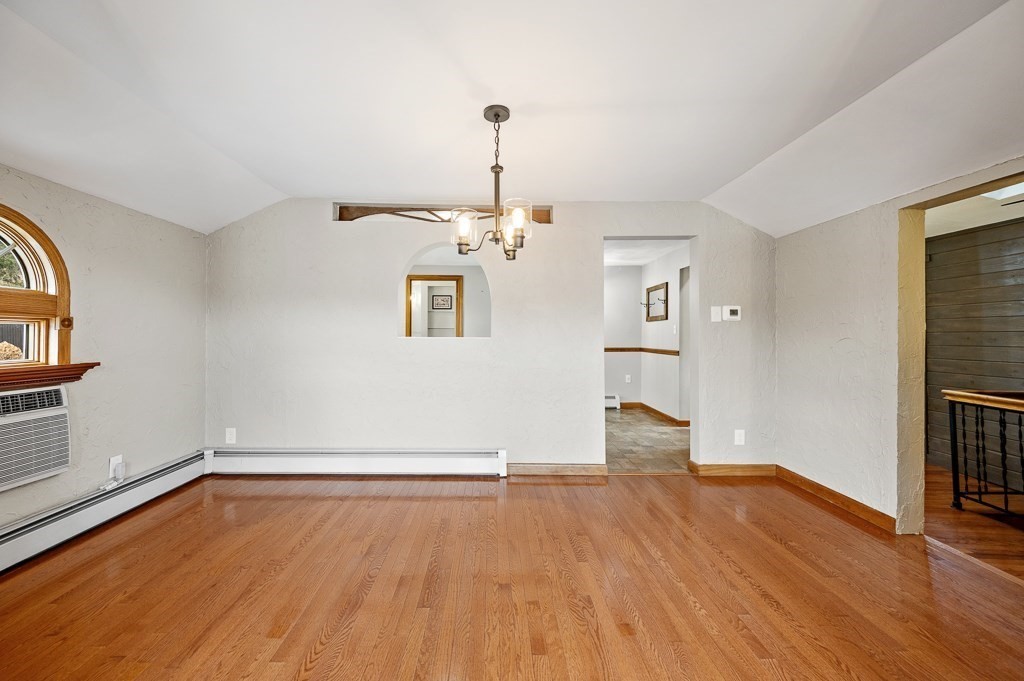 59 Cranberry Meadow Shore Road Charlton, MA 01507 - Photo 17 of 36 a view of empty room with wooden floor and fireplace
