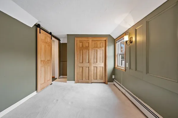 a view of an empty room with a fireplace