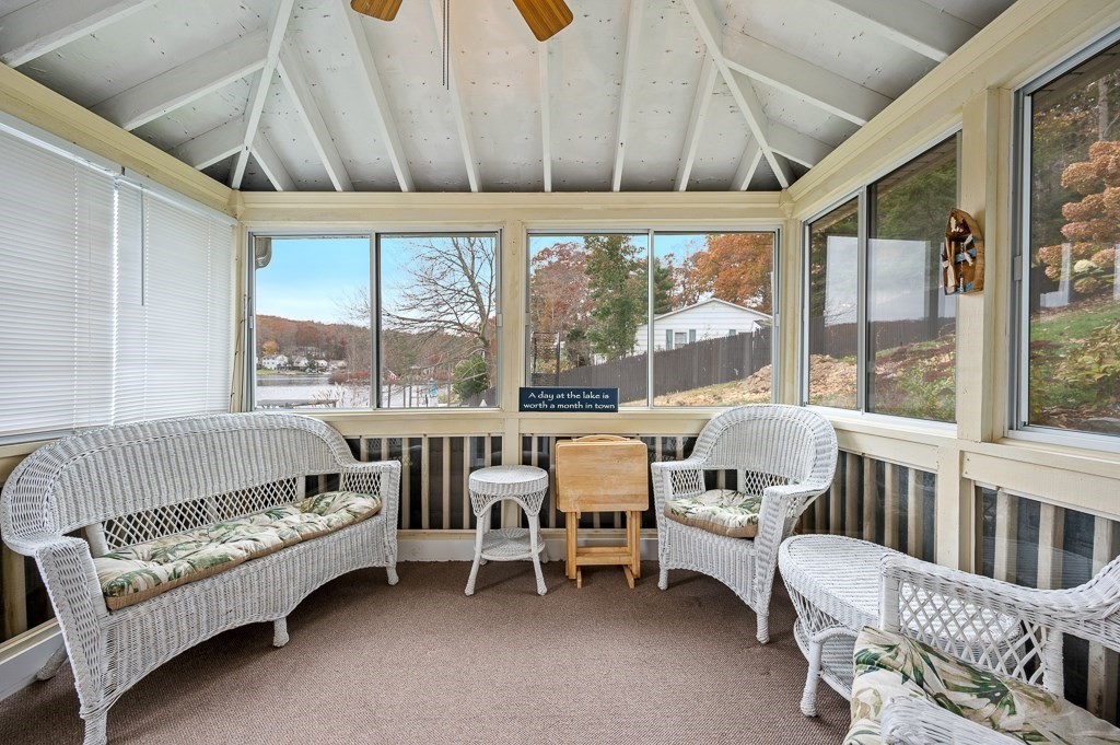59 Cranberry Meadow Shore Road Charlton, MA 01507 - Photo 29 of 36 a living room with furniture and a large window