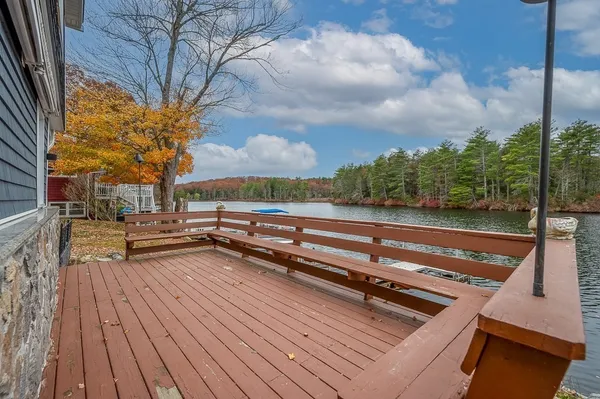 a view of a lake with a house in the background