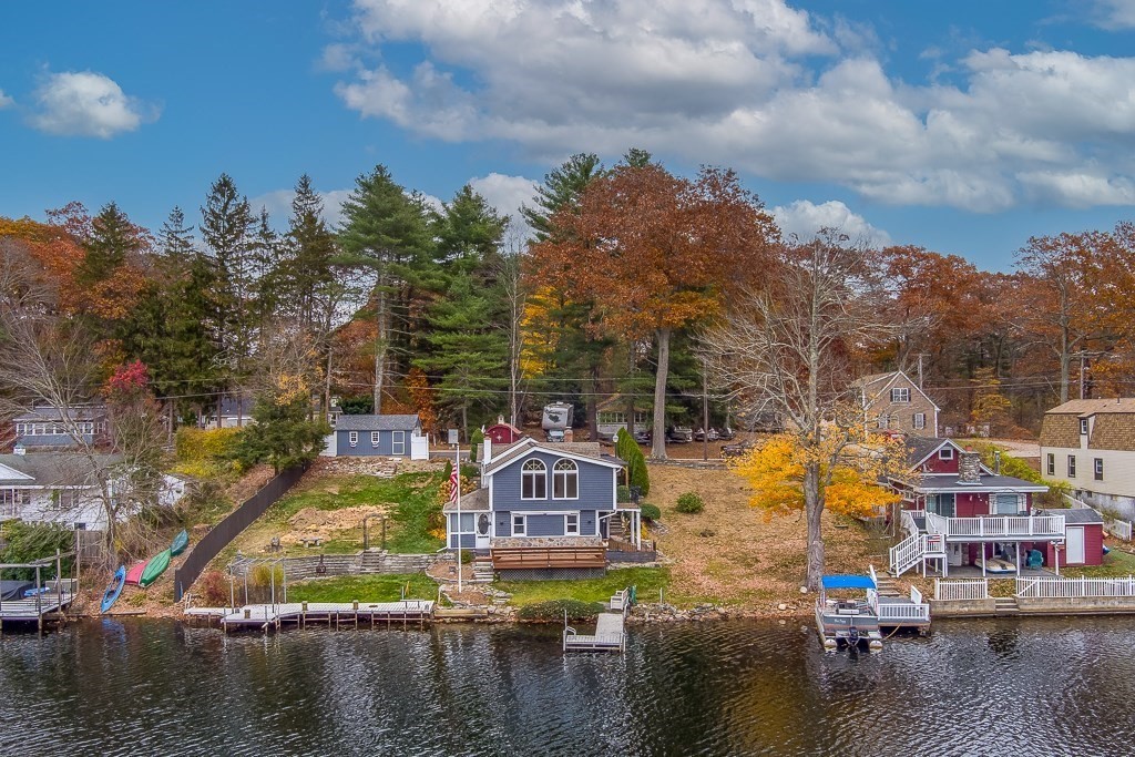 59 Cranberry Meadow Shore Road Charlton, MA 01507 - Photo 34 of 36 a view of a lake with a house in the background