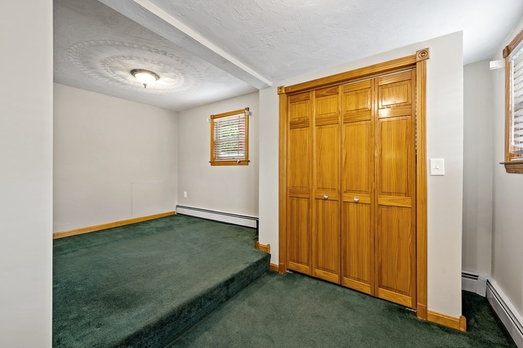59 Cranberry Meadow Shore Road Charlton, MA 01507 - Photo 4 of 36 a view of an empty room with window