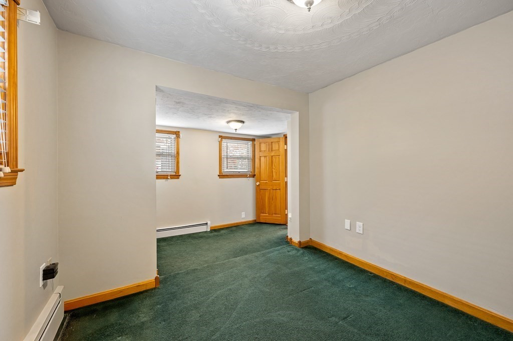 59 Cranberry Meadow Shore Road Charlton, MA 01507 - Photo 6 of 36 an empty room with windows