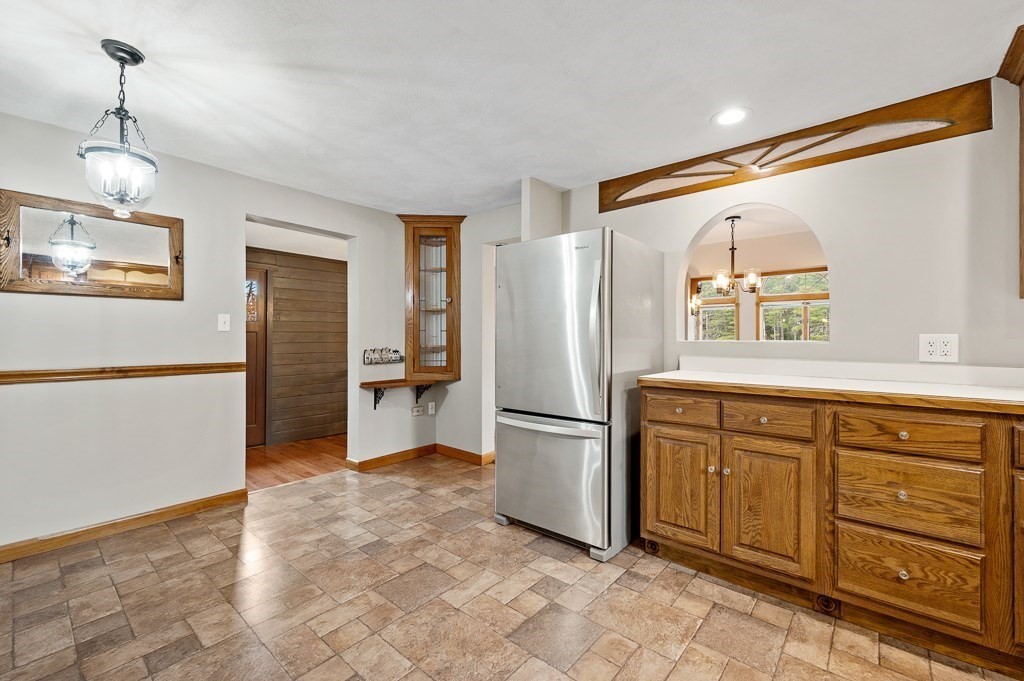 59 Cranberry Meadow Shore Road Charlton, MA 01507 - Photo 10 of 36 a kitchen with stainless steel appliances granite countertop a refrigerator and a sink