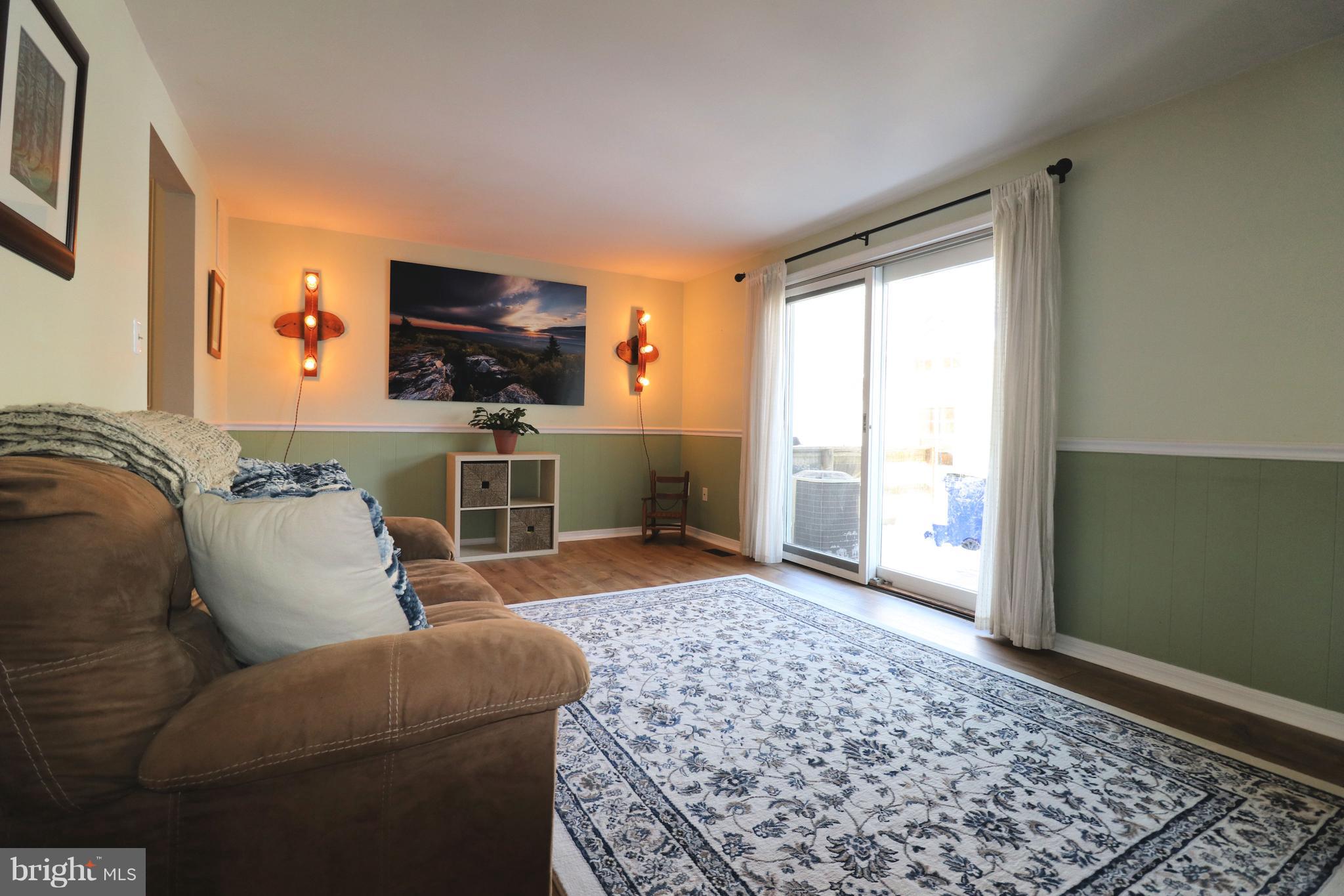 17514 Kohlhoss Road Poolesville, MD 20837 - Photo 10 of 20 a living room with furniture and a flat screen tv