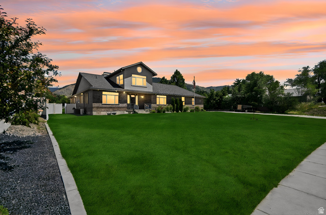 580 North 300 East Logan, UT 84321 - Photo 1 of 74 Expansive front lawn with a concrete pathway leading to the main entrance