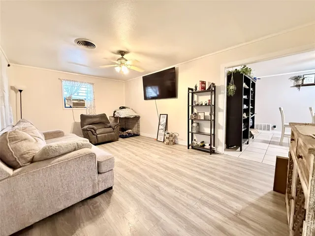 a kitchen with stainless steel appliances kitchen island granite countertop a refrigerator and a stove
