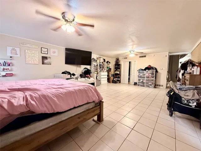 a living room with furniture a fireplace and a window
