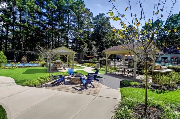 a view of a backyard with sitting area