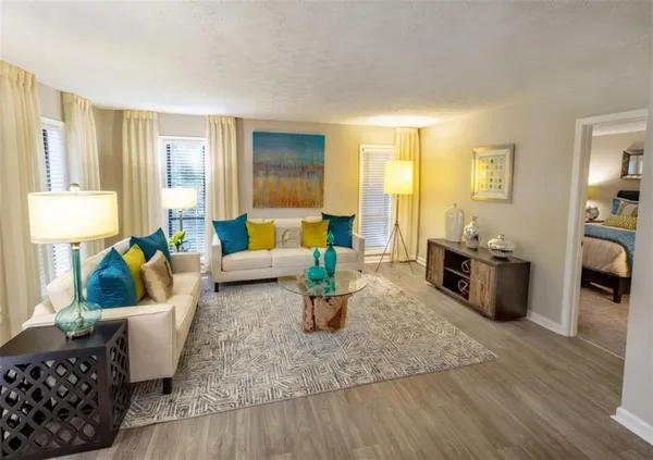 a living room with furniture and a table