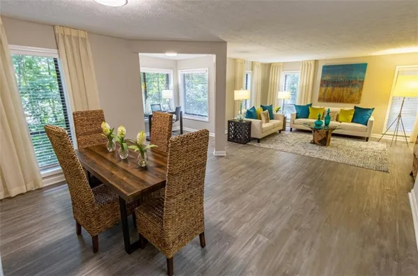 a view of a livingroom with furniture and a wooden floor