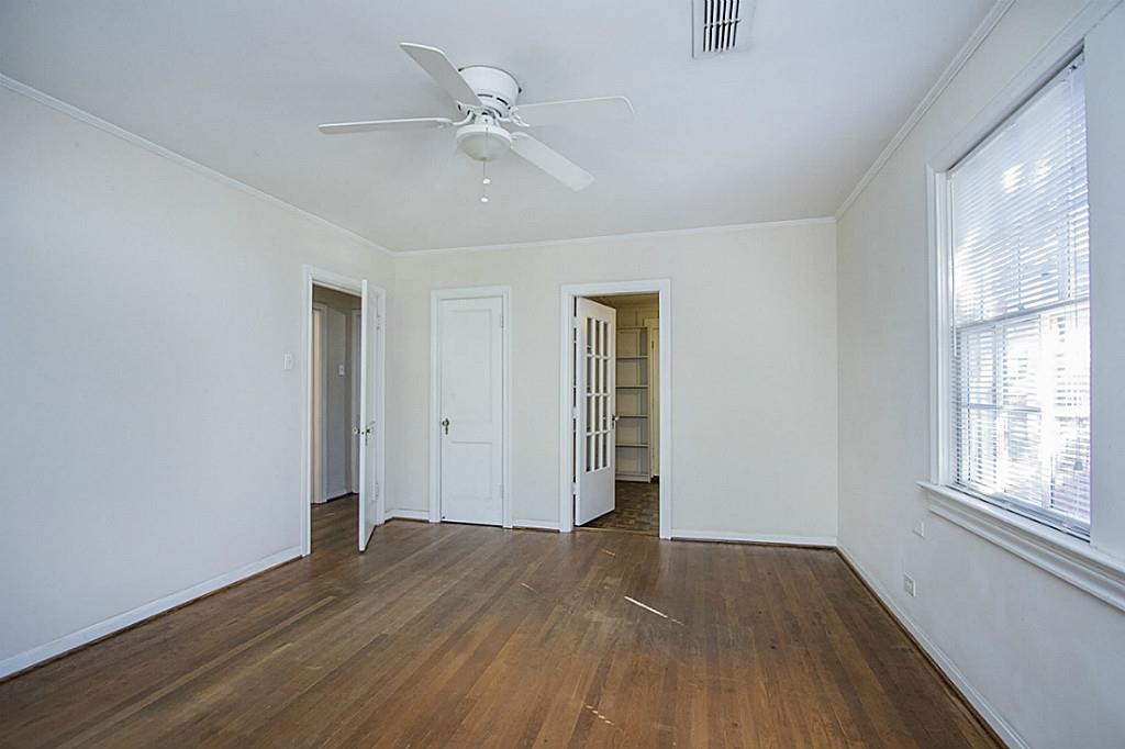1843 Branard Street, Unit A Houston, TX 77098 - Photo 12 of 19 a view of empty room with wooden floor and fan