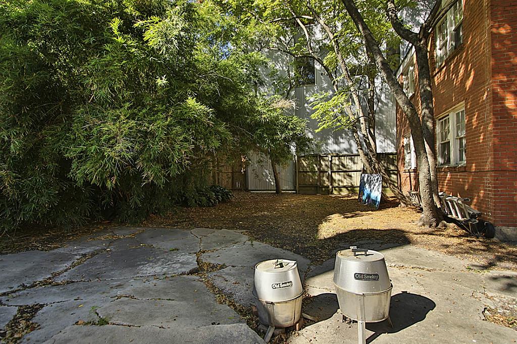 1843 Branard Street, Unit A Houston, TX 77098 - Photo 19 of 19 a view of a table and chairs in backyard
