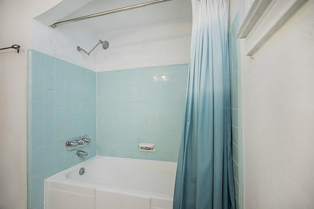 1843 Branard Street, Unit A Houston, TX 77098 - Photo 3 of 19 a bathroom with a bathtub and shower