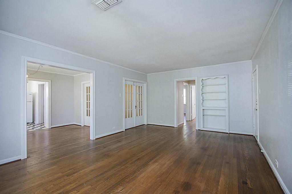 1843 Branard Street, Unit A Houston, TX 77098 - Photo 6 of 19 a view of an empty room with wooden floor