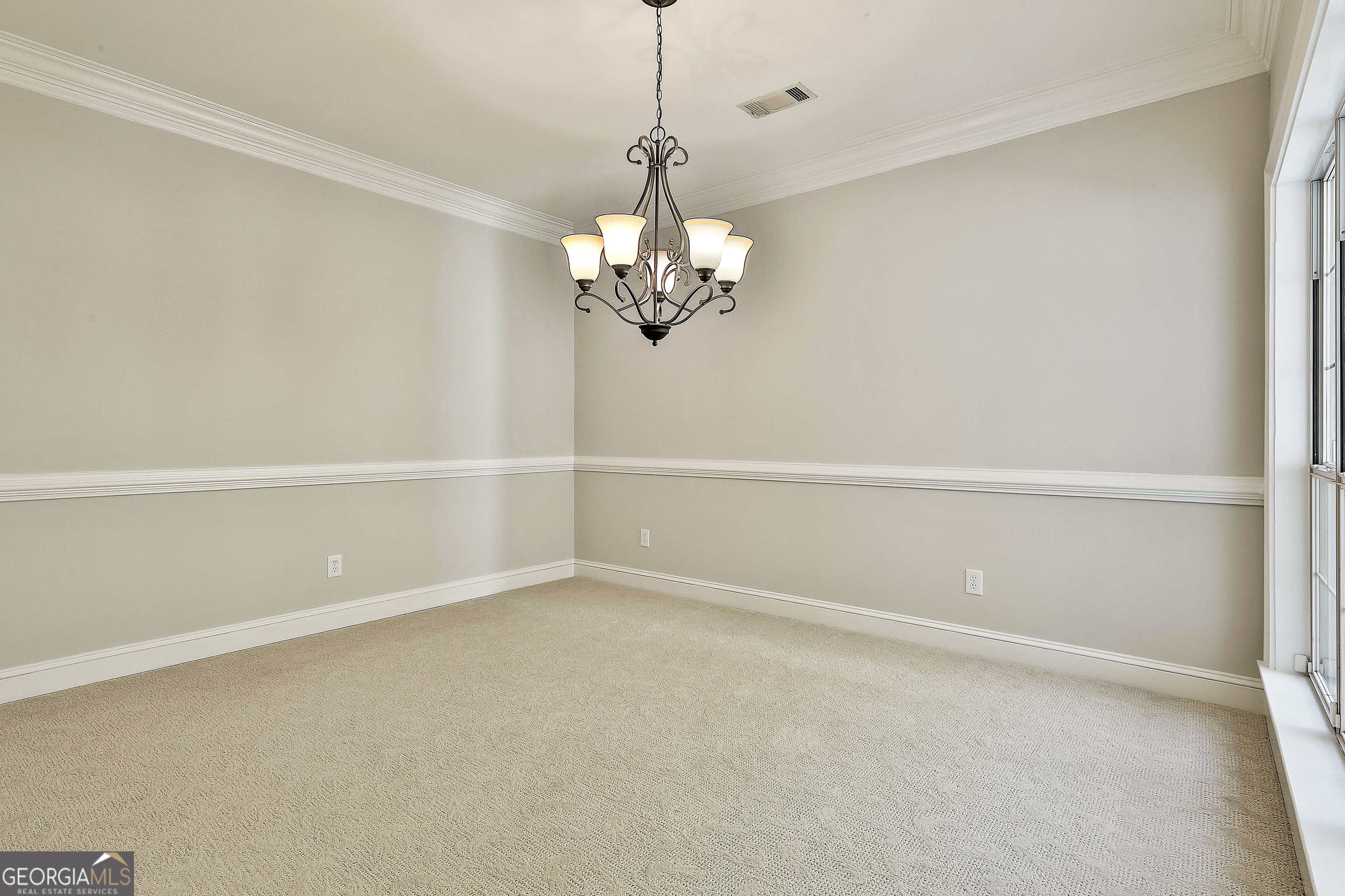 365 Pendleton Trail Tyrone, GA 30290 - Photo 12 of 55 a view of a chandelier in an empty room