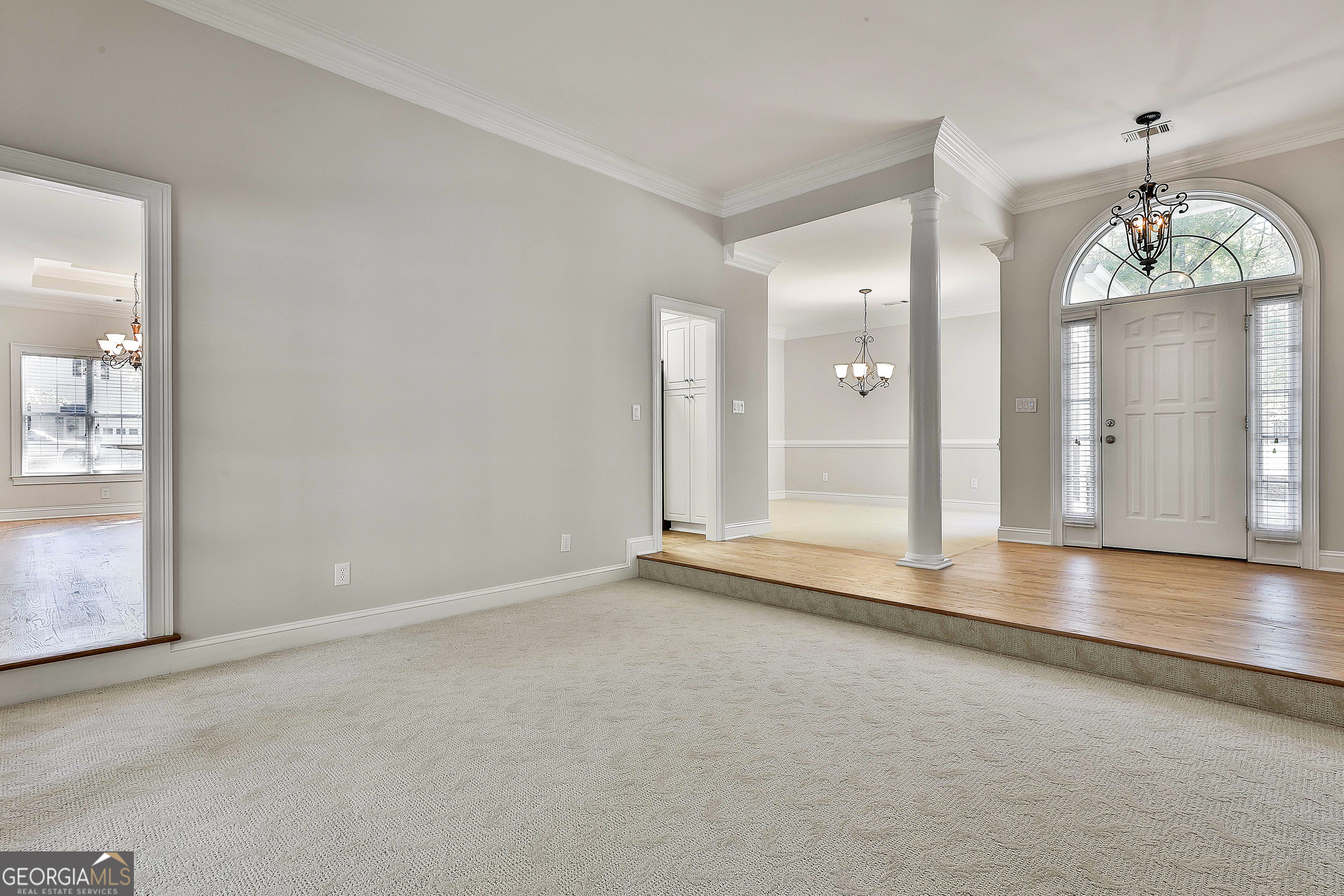 365 Pendleton Trail Tyrone, GA 30290 - Photo 16 of 55 an empty room with wooden floor and windows