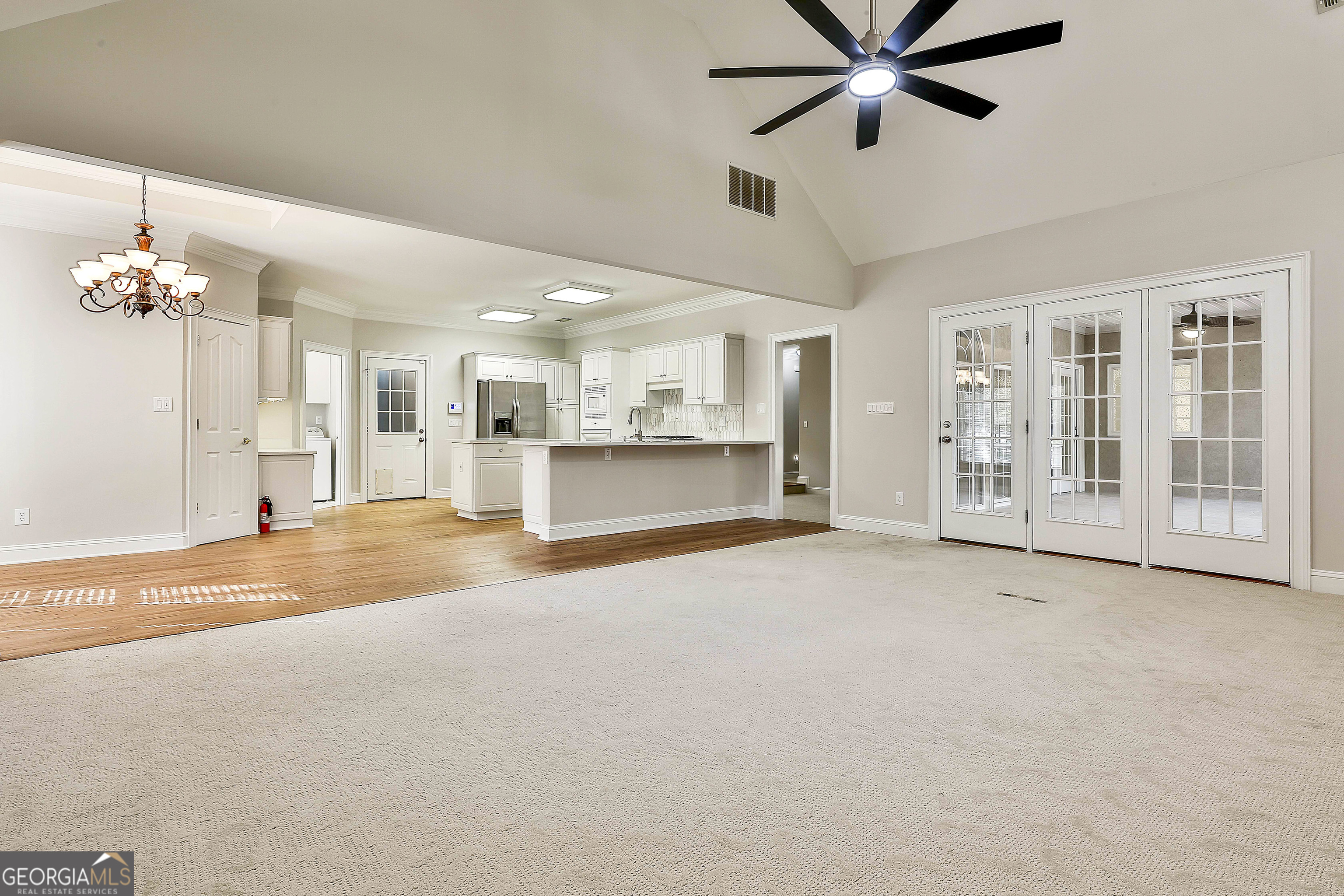 365 Pendleton Trail Tyrone, GA 30290 - Photo 20 of 55 a view of a livingroom with a chandelier fan and windows