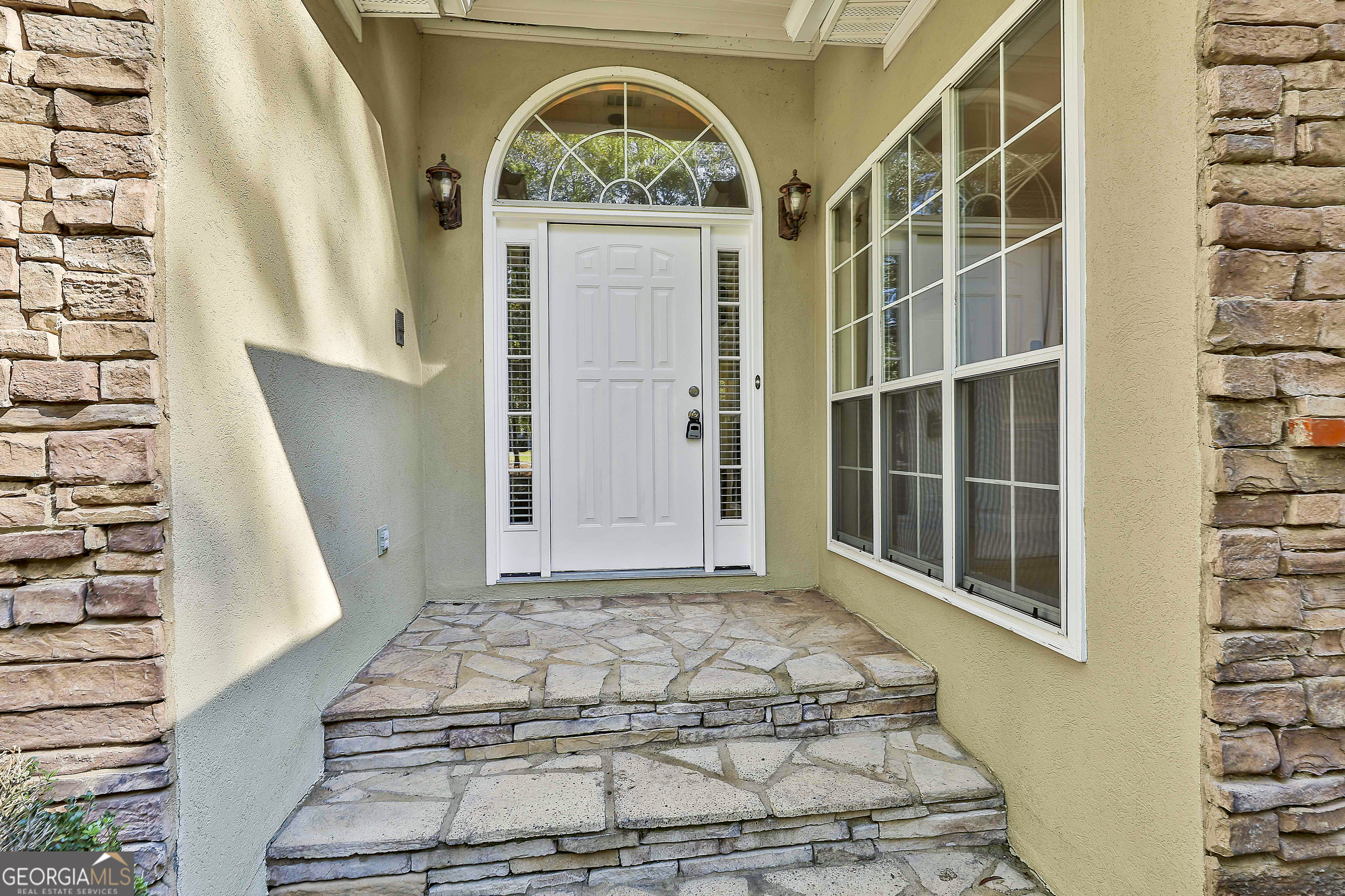 365 Pendleton Trail Tyrone, GA 30290 - Photo 9 of 55 a view of a door with wooden floor and a potted plant