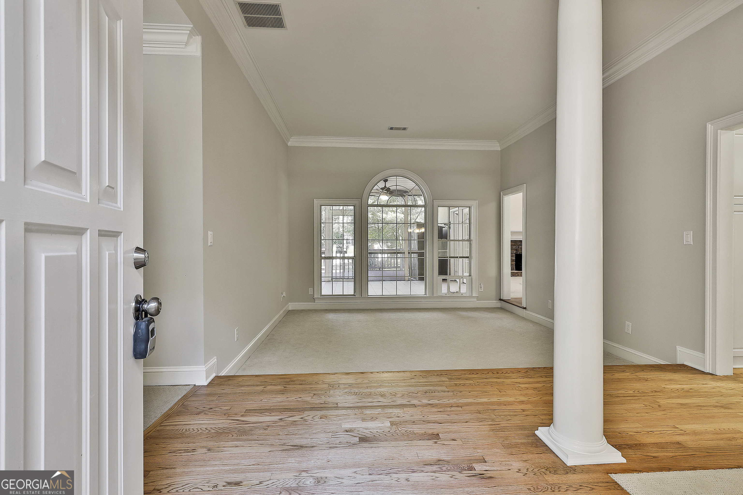 365 Pendleton Trail Tyrone, GA 30290 - Photo 10 of 55 an empty room with wooden floor and windows