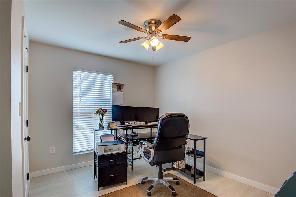 521 Private Road Brookston, TX 75421 - Photo 16 of 26 a view of a workspace with furniture and a window
