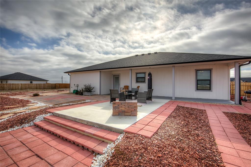 521 Private Road Brookston, TX 75421 - Photo 17 of 26 a view of a backyard with sitting area