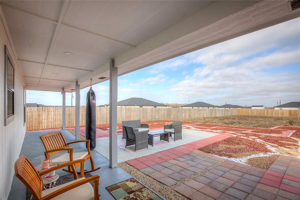 521 Private Road Brookston, TX 75421 - Photo 19 of 26 a balcony with furniture and a ocean view