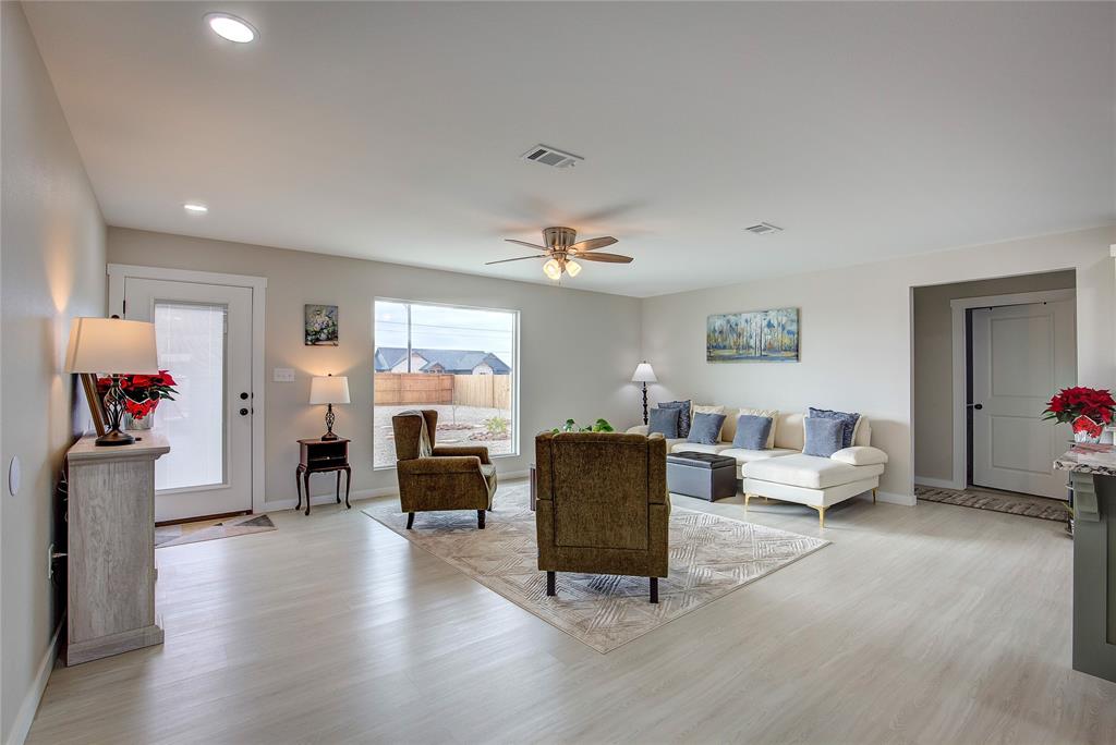 521 Private Road Brookston, TX 75421 - Photo 3 of 26 a living room with furniture and a fireplace