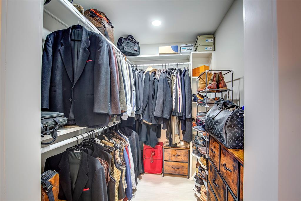 521 Private Road Brookston, TX 75421 - Photo 10 of 26 a view of walk in closet with clothes