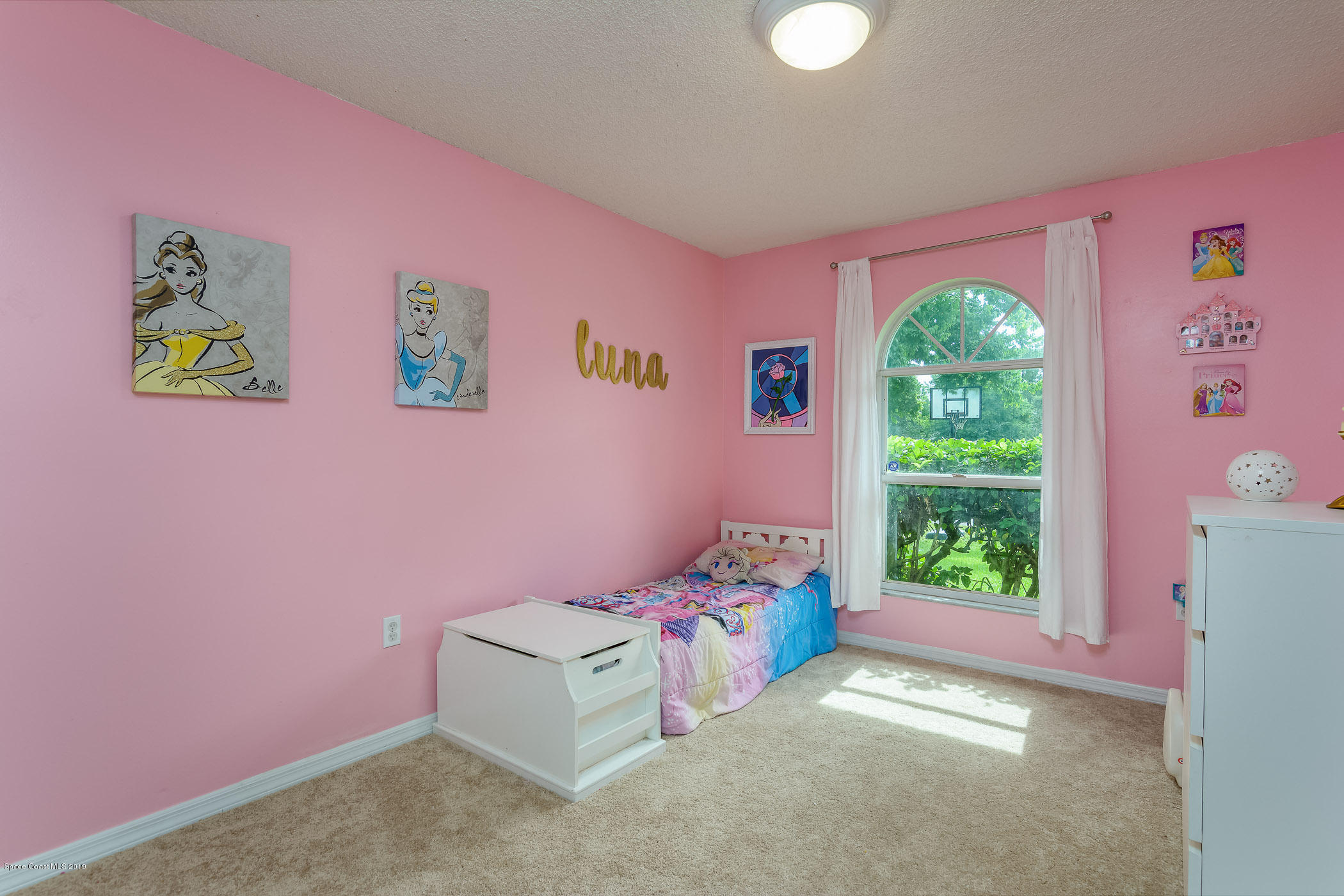 7010 Cairo Road Cocoa, FL 32927 - Photo 11 of 22 a bedroom with a bed and a window