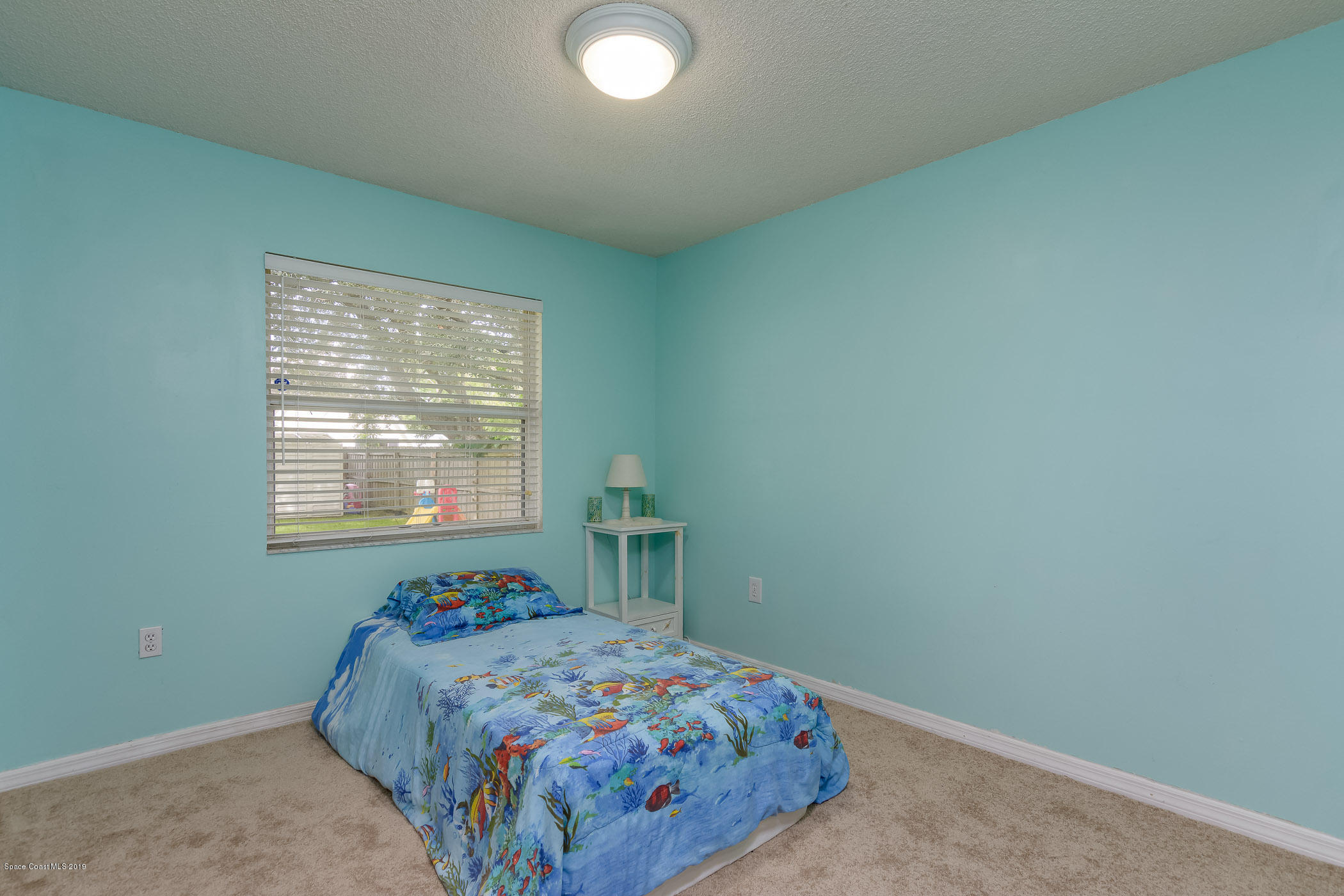 7010 Cairo Road Cocoa, FL 32927 - Photo 13 of 22 a bedroom with a bed and a window
