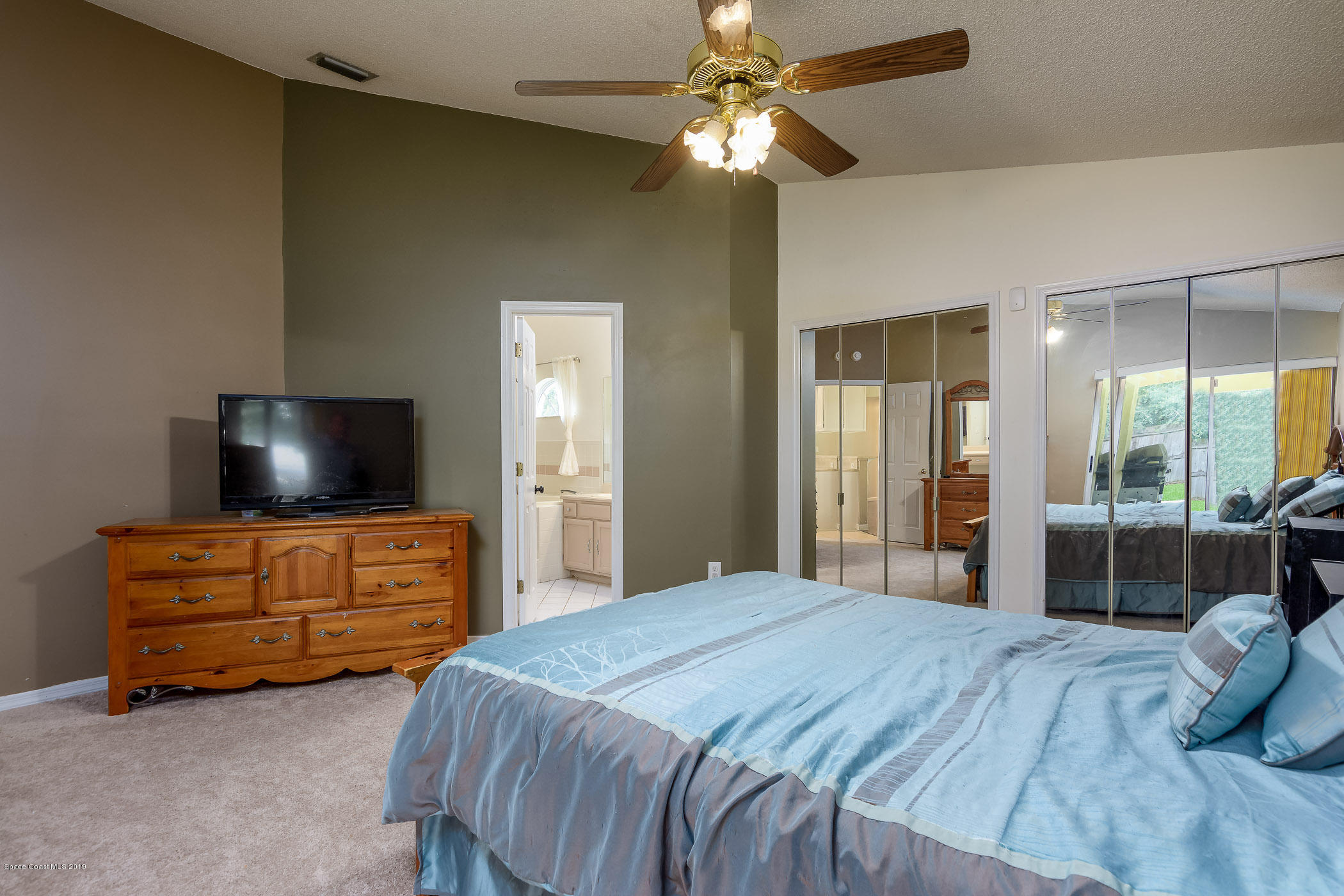 7010 Cairo Road Cocoa, FL 32927 - Photo 15 of 22 a bedroom with two bed and flat screen tv