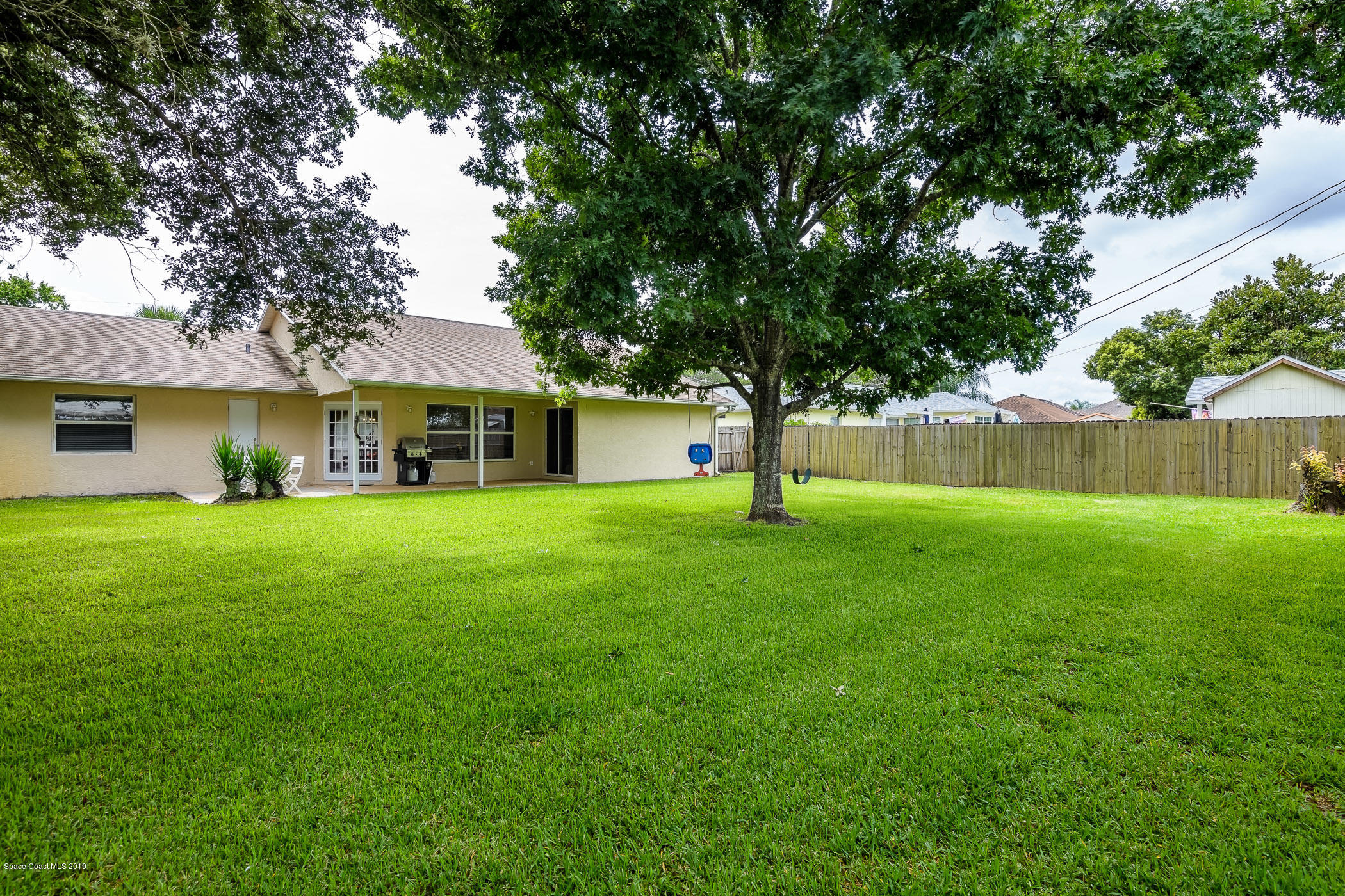 7010 Cairo Road Cocoa, FL 32927 - Photo 20 of 22 a front view of a house with a yard