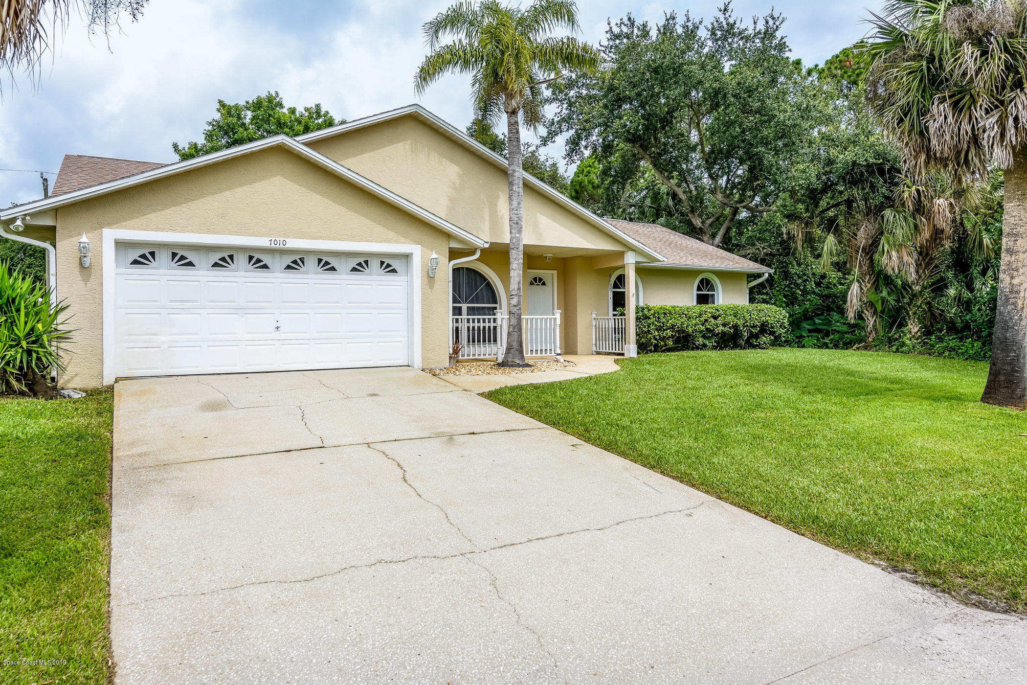 7010 Cairo Road Cocoa, FL 32927 - Photo 3 of 22 a view of a house with a yard