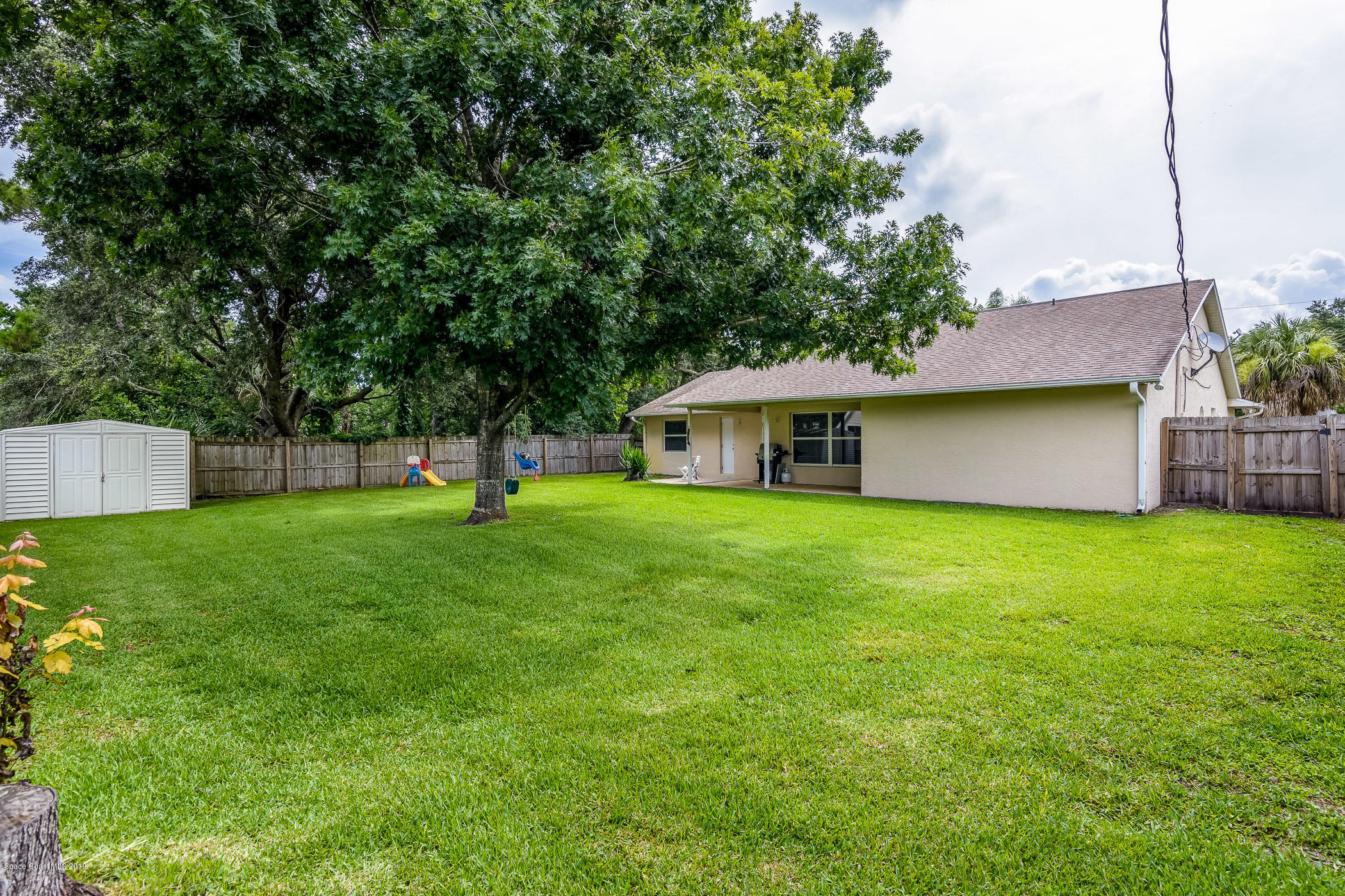 7010 Cairo Road Cocoa, FL 32927 - Photo 21 of 22 a front view of house with a garden