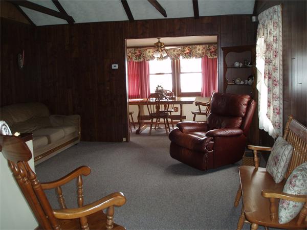 124 1/2 Manchaug Road Sutton, MA 01590 - Photo 18 of 30 a living room with furniture and a large window