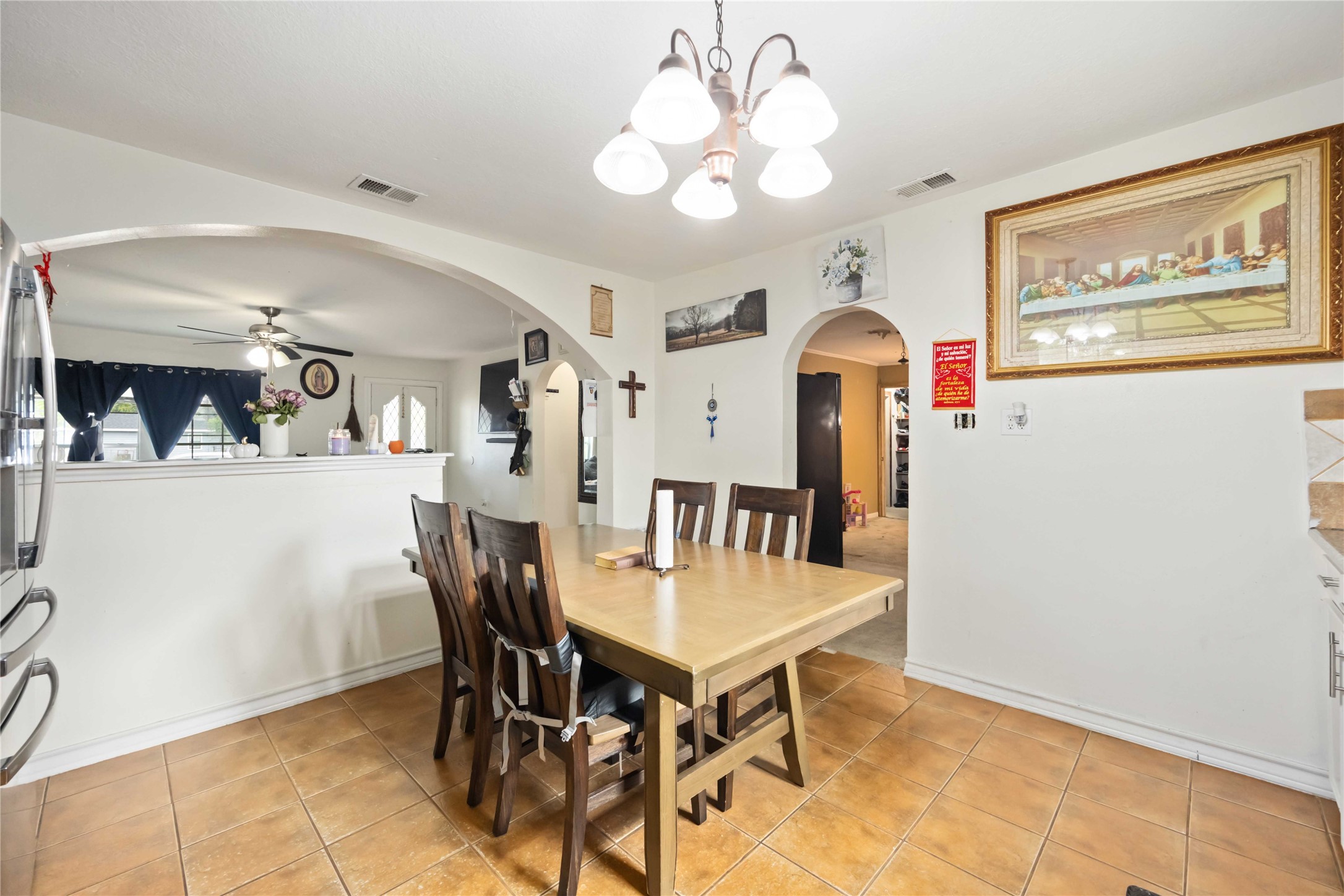 5119 Terry Street Houston, TX 77009 - Photo 12 of 30 a view of a dining room with furniture and chandelier