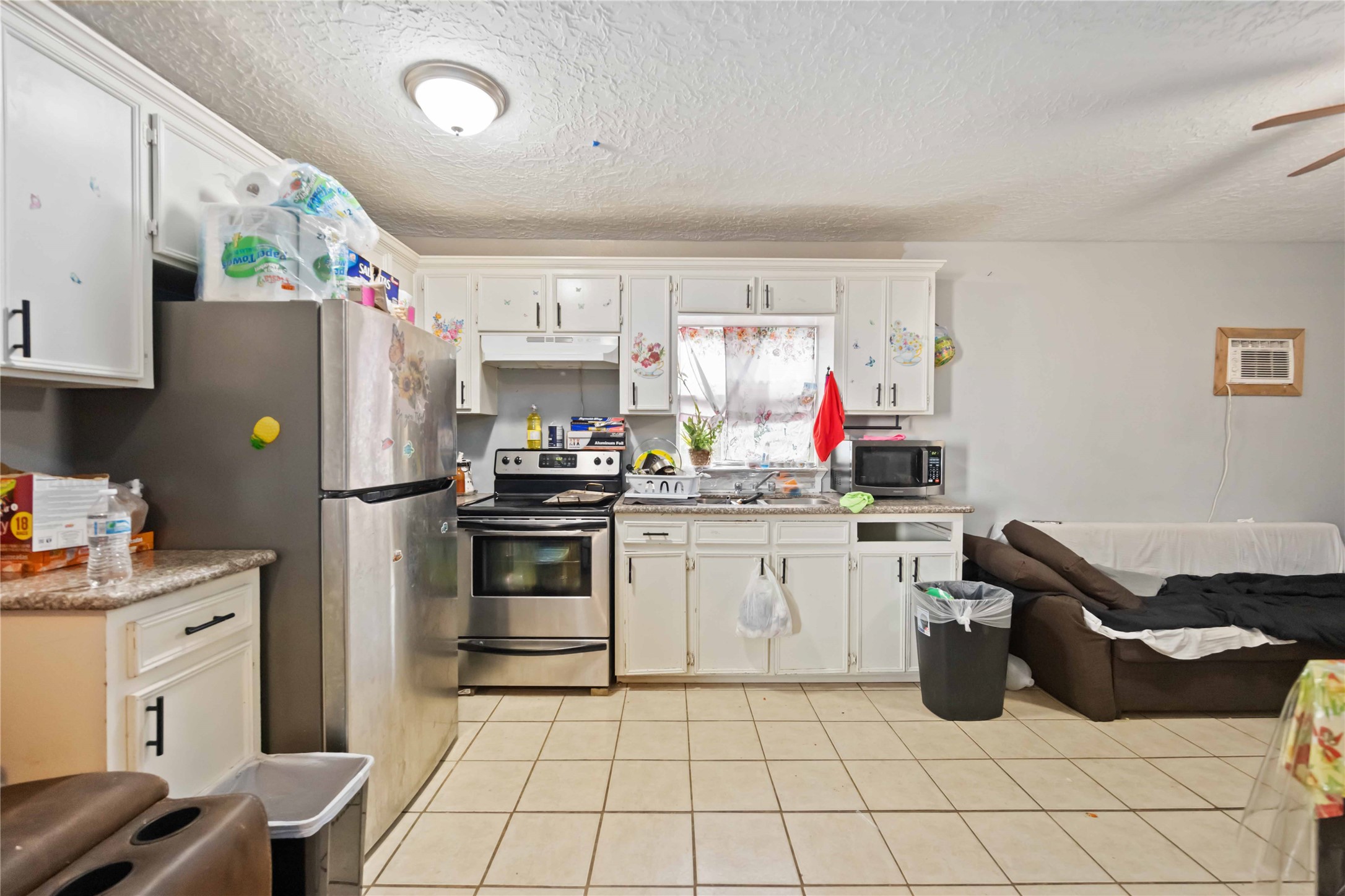 5119 Terry Street Houston, TX 77009 - Photo 24 of 30 a kitchen with a refrigerator sink and cabinets