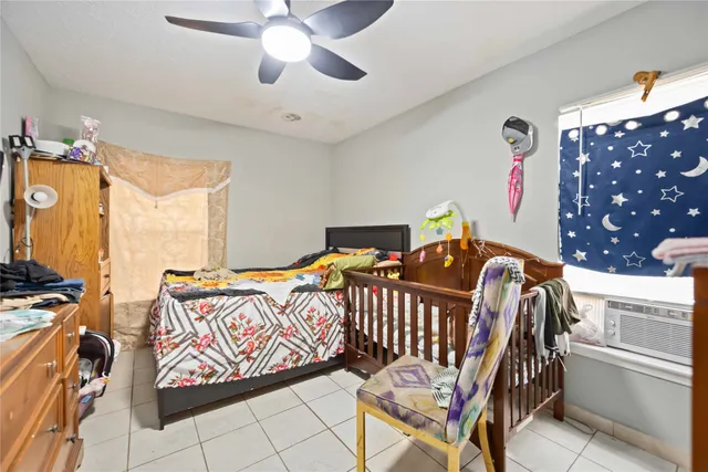 a view of bathroom with a toilet and a shower curtain