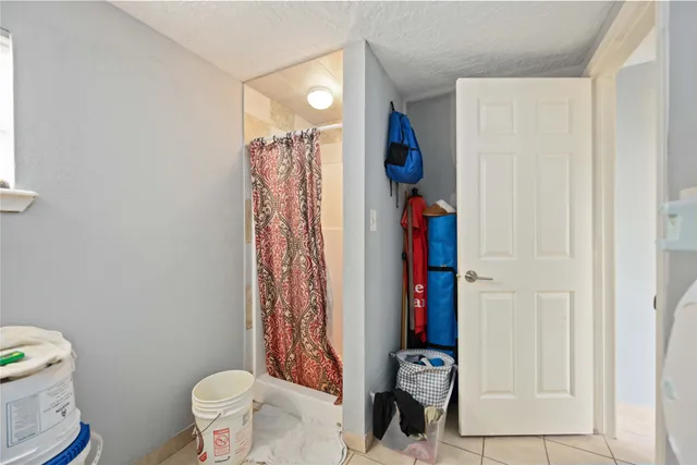 a bathroom with a toilet a sink and a mirror
