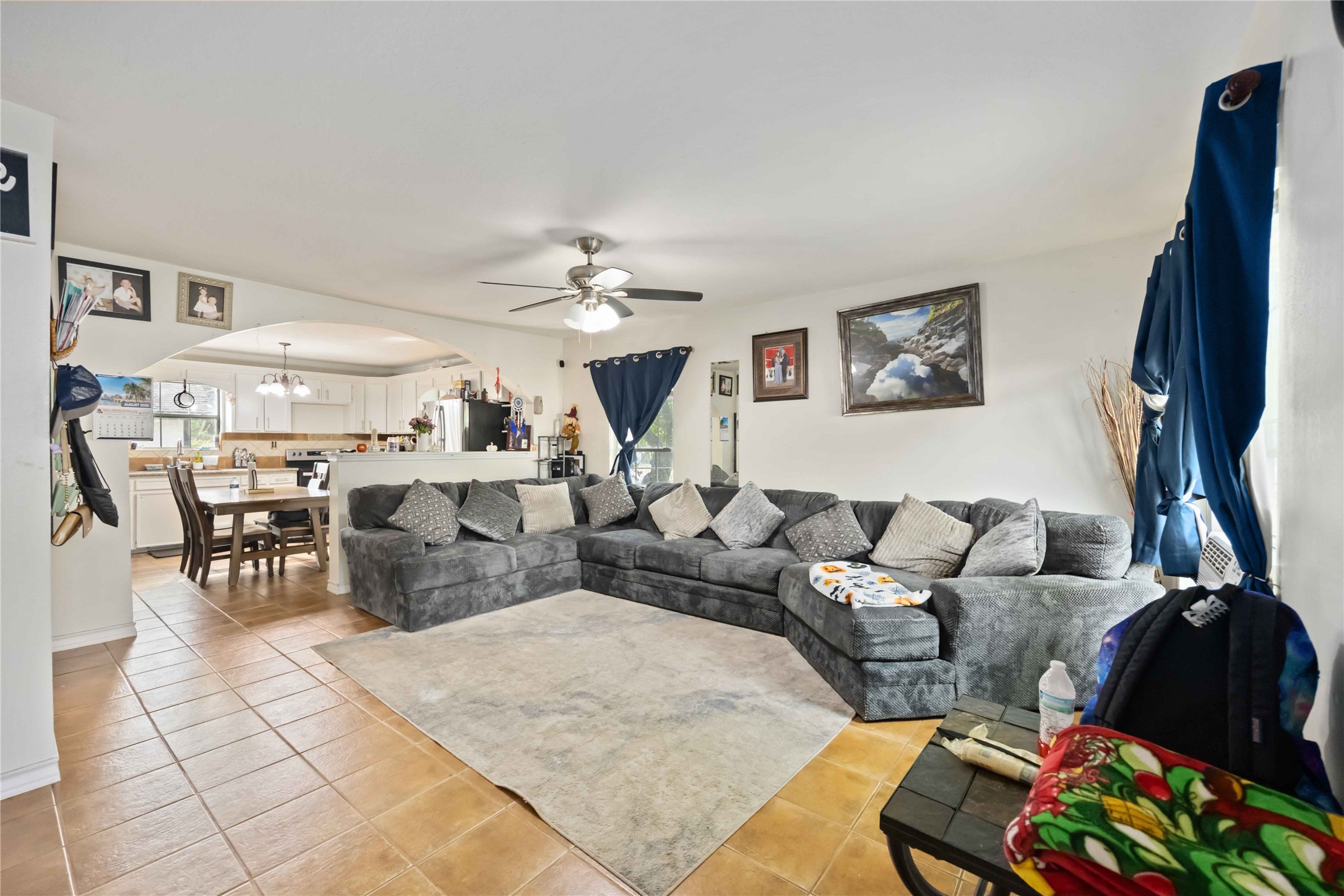 5119 Terry Street Houston, TX 77009 - Photo 6 of 30 a living room with furniture and a chandelier