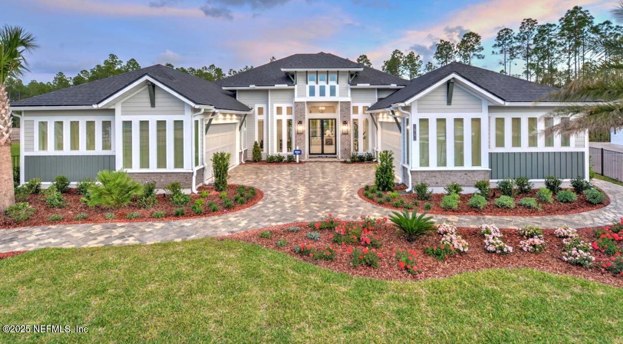 539 Chestnut Oak Road St. Augustine, FL 32092 - Photo 1 of 1 a front view of a house with a yard and pathway