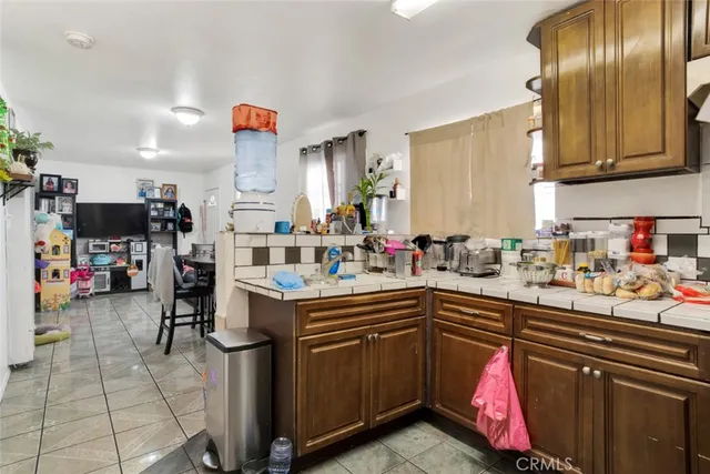 a kitchen with lots of counter top space and appliances