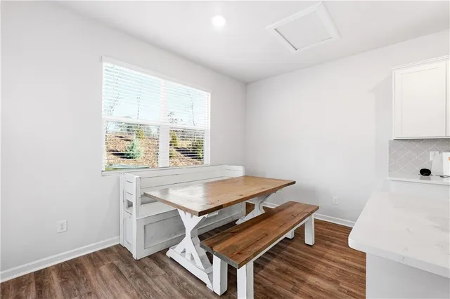 a room with a table and a window