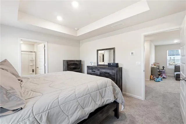 a bedroom with a bed and a mirror