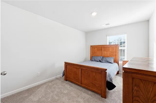 a room with a bed and a window